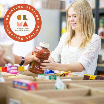 Image of a smiling teenage girl packing food into boxes.